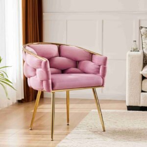 Stylish pink velvet accent chair with metal structure.